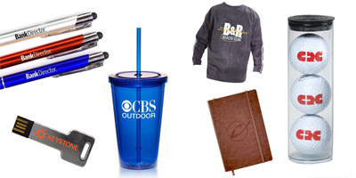 A variety of promotional products including pens, cups, usb thumb drive, sweatshirt, binder and golf balls.