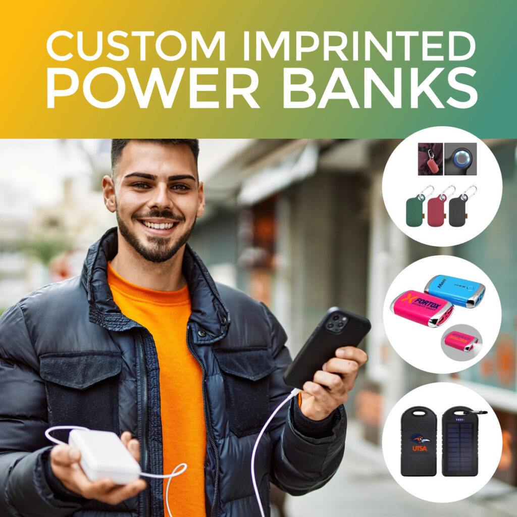 Man holding a custom imprinted power bank and attached to cell phone