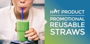 Woman drinking a green smoothie through a reusable straw