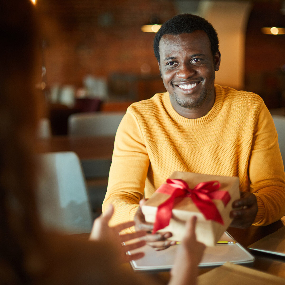 Man receiving a personalized gift from his company